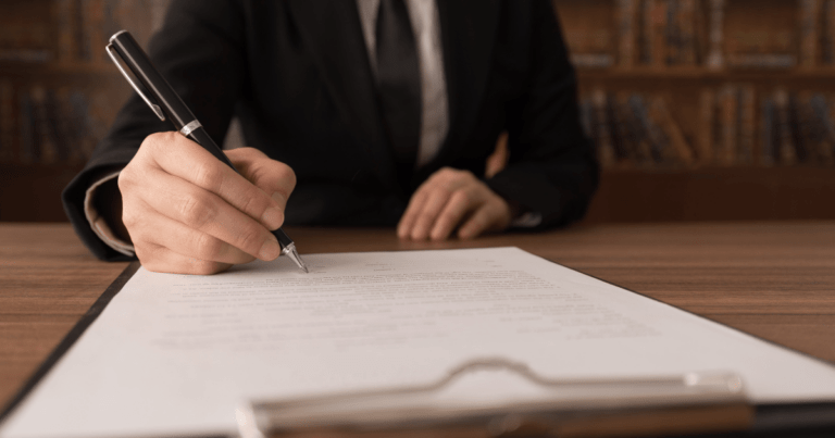 Man writing clipboard