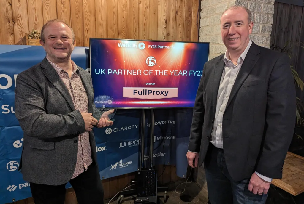 Photo of CEO Ewan and CTO Chris collecting the F5 Gold Partner of year award